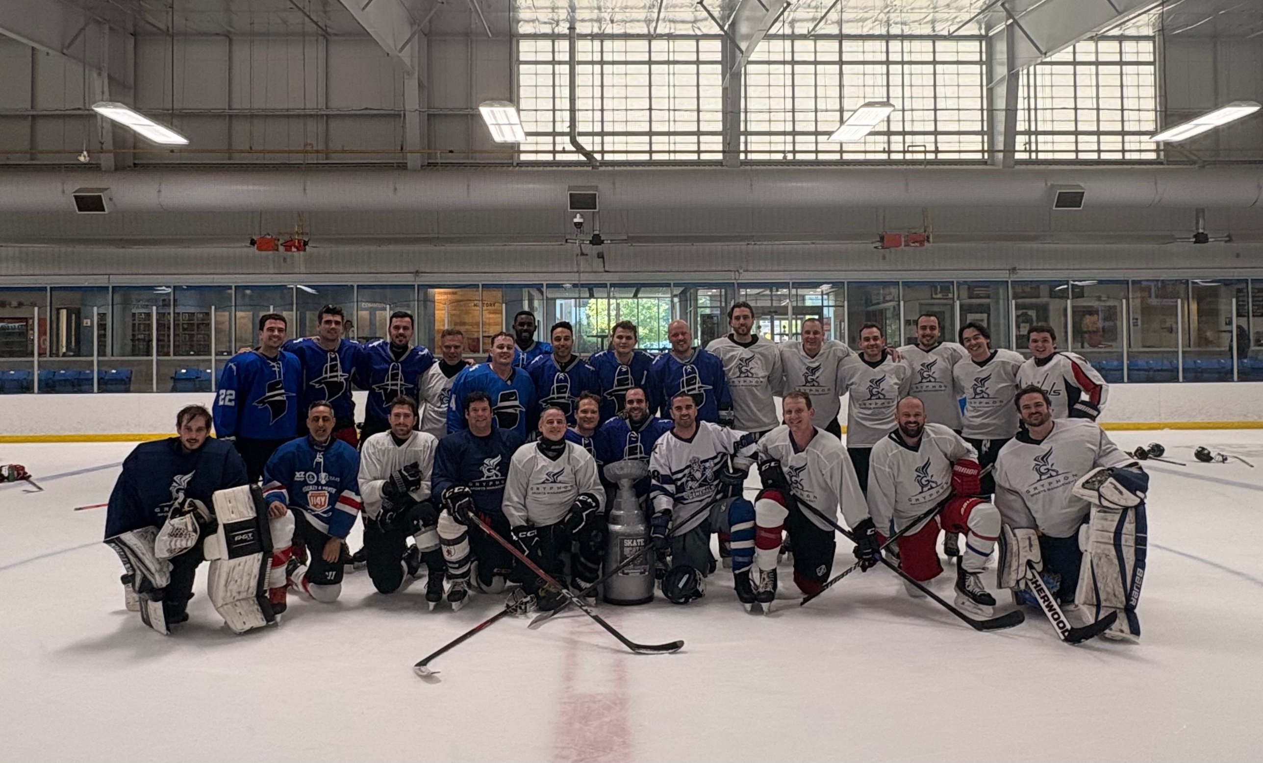 Players from both teams with the Skate & Scale trophy at the May 2026 Toronto Tech Week game
